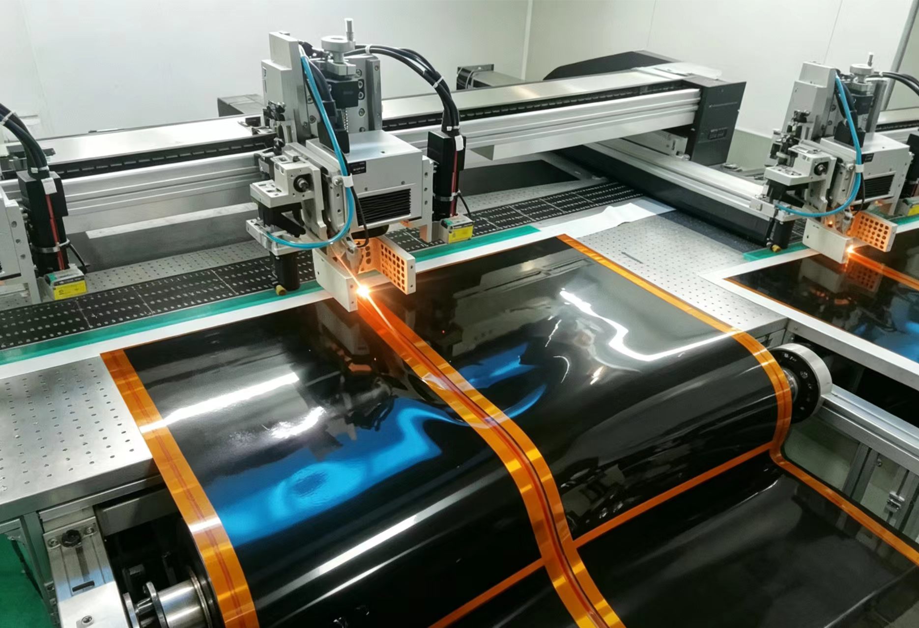 Automated graphene heating film printing line with copper bus bars on a continuous substrate — representative of in-house OEM and ODM manufacturing capability